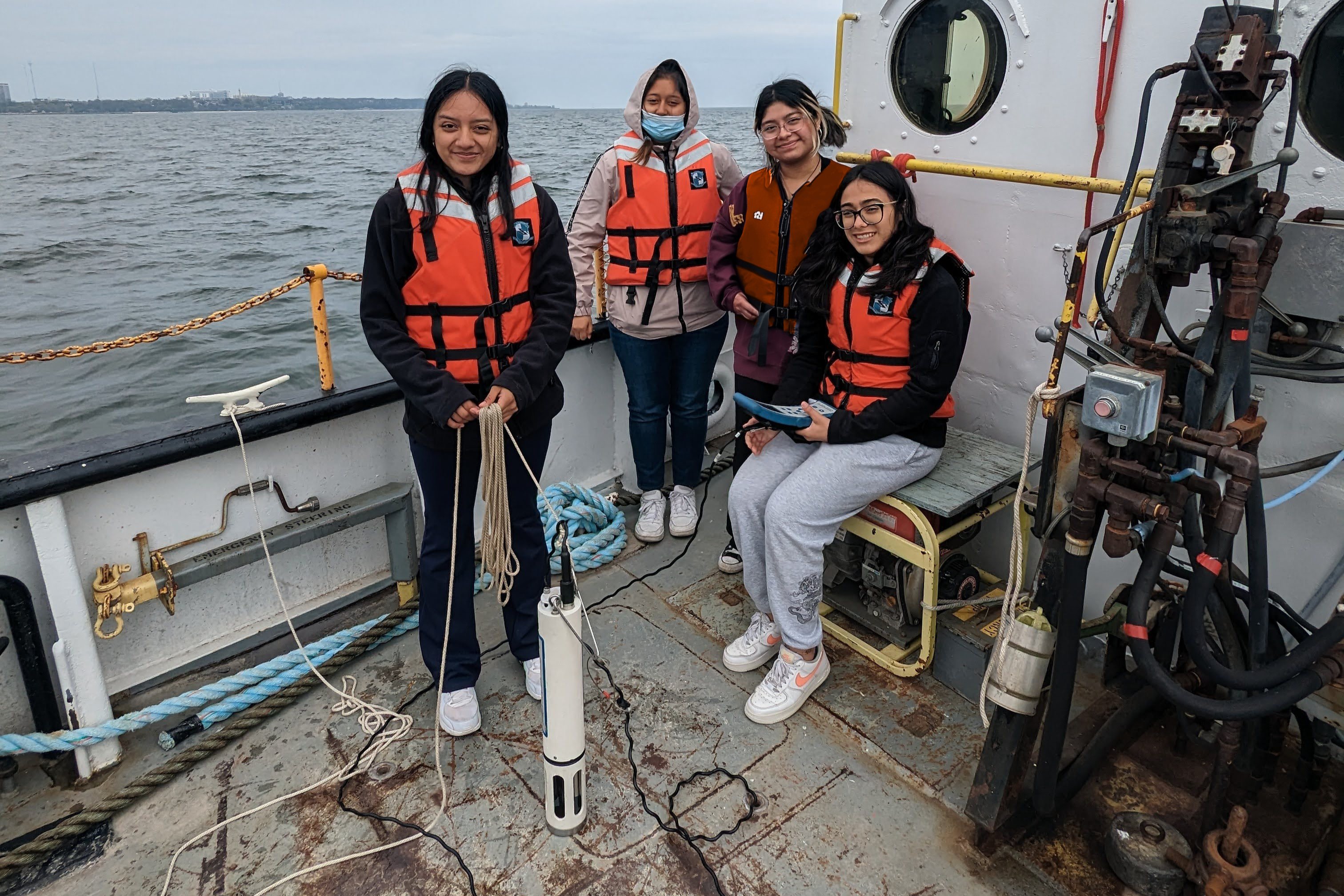 High school students aboard research vessel using the Hydrolab.